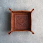 Arizona leather valet tray with snapped corners and the initials BJH pressed into the diamond frame, seen from above