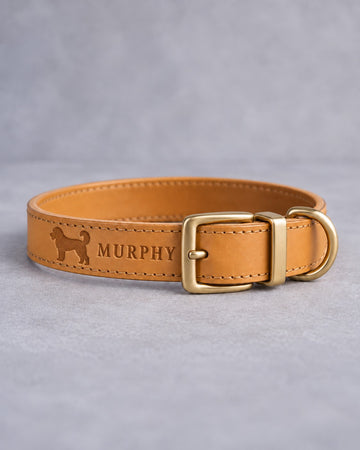 Indian Summer leather dog collar with a goldendoodle silhouette and the name MURPHY debossed, brass pin buckle
