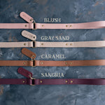 Leather dog leash shown in soft blush and caramel tones with engraved tabs