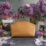 Indian summer leather makeup pouch personalized with the name Madison in gold, lilac blooms around