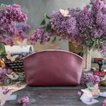 Makeup Bag In Sangria Leather with hand-finished detailing