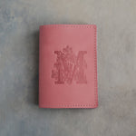 Parisian Blossom leather passport cover with a large floral initial M pressed into the front