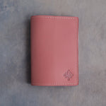 Parisian Blossom leather passport cover with a flower initial pressed into the bottom corner
