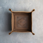 Sicilian Brown leather valet tray with snapped corners and the initials DAD pressed into the diamond frame, seen from above