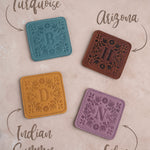 Floral leather coasters shown in four leather colors