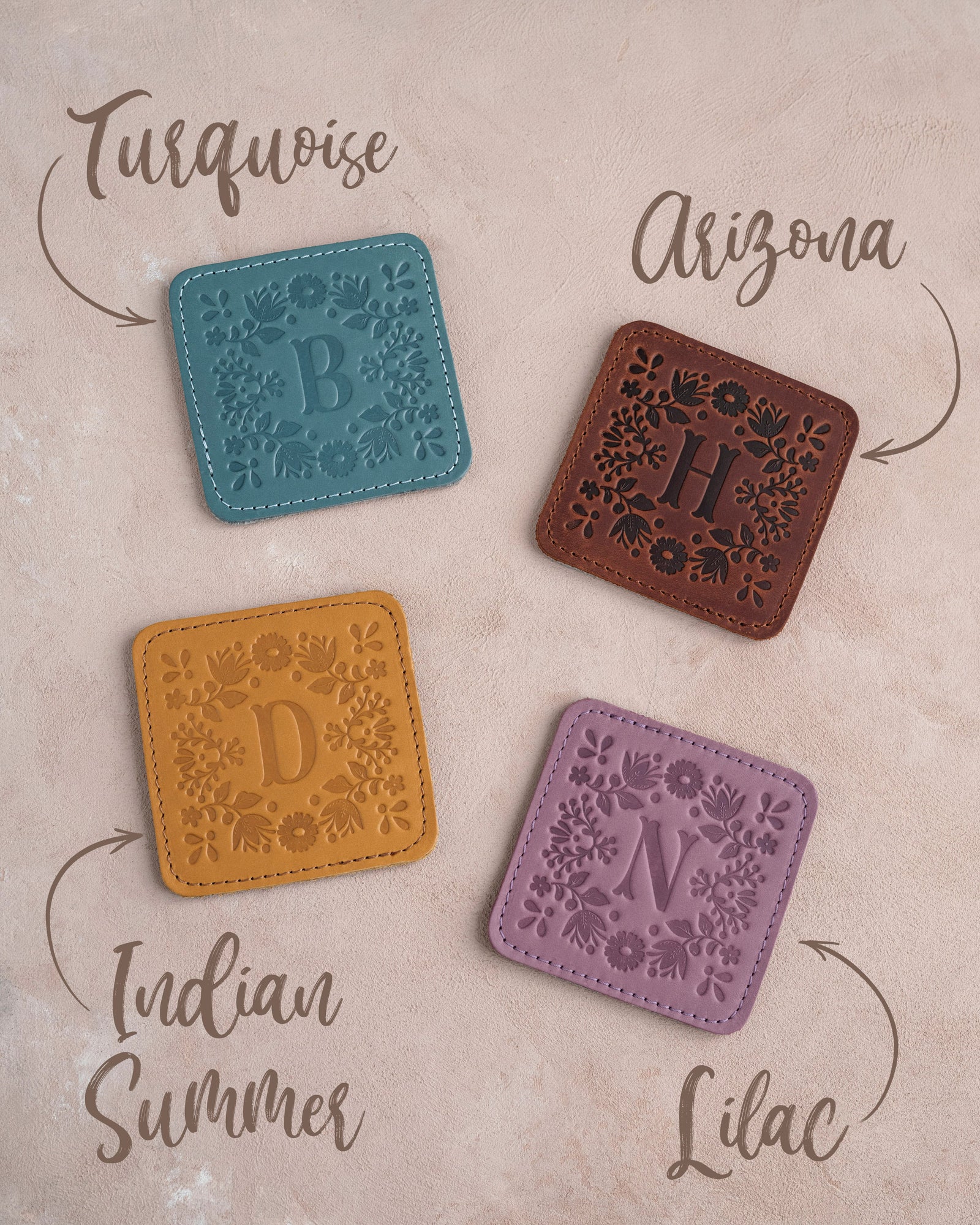 Floral leather coasters shown in four leather colors