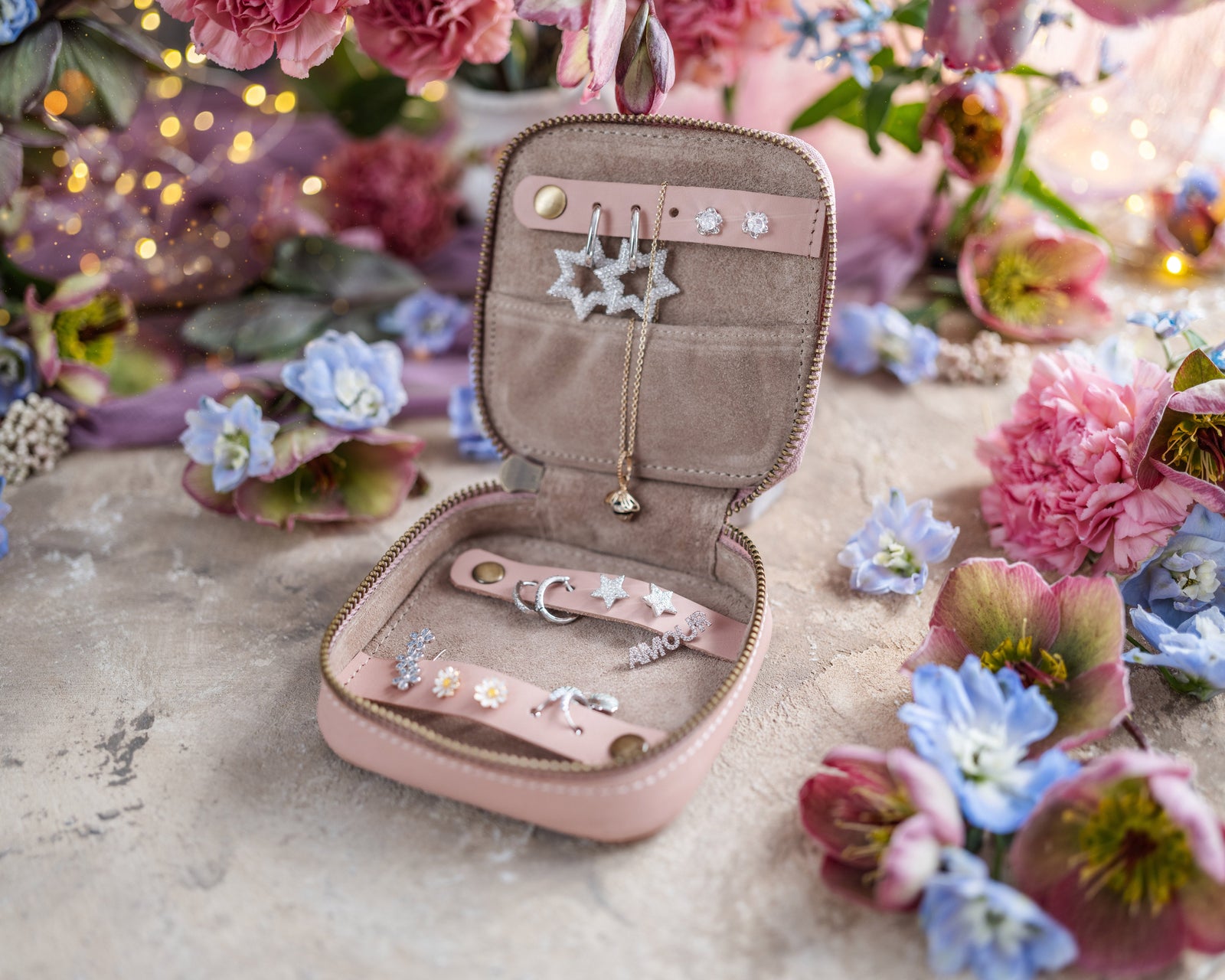 Open leather jewelry box showing the lined interior