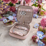 Open leather jewelry box showing the lined interior