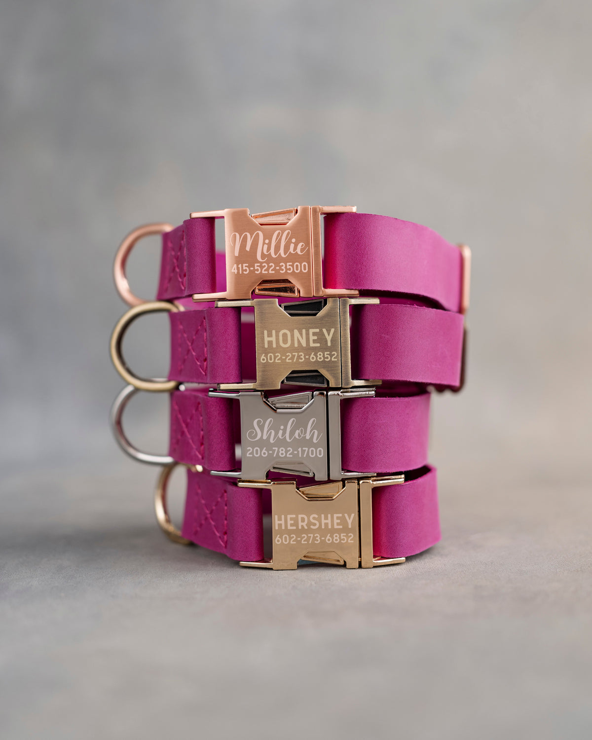 Hot Pink dog collars in Fuchsia full-grain leather, 1 in wide, with quick release buckles engraved with names