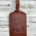 Real logo stamp sample: a company logo blind-debossed into an Arizona leather luggage tag