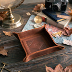 Arizona leather valet tray monogrammed BJH on a wooden desk