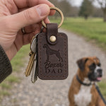 Dark espresso Boxer Dad leather keychain held in a warm everyday setting