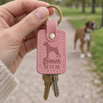 Parisian Blossom pink Boxer Mom leather keychain placed in a warm everyday setting