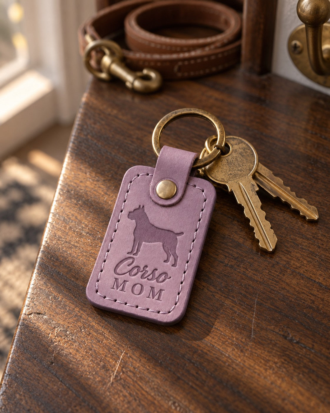Lilac Corso Mom keychain on a sunny kitchen island beside a coffee cup