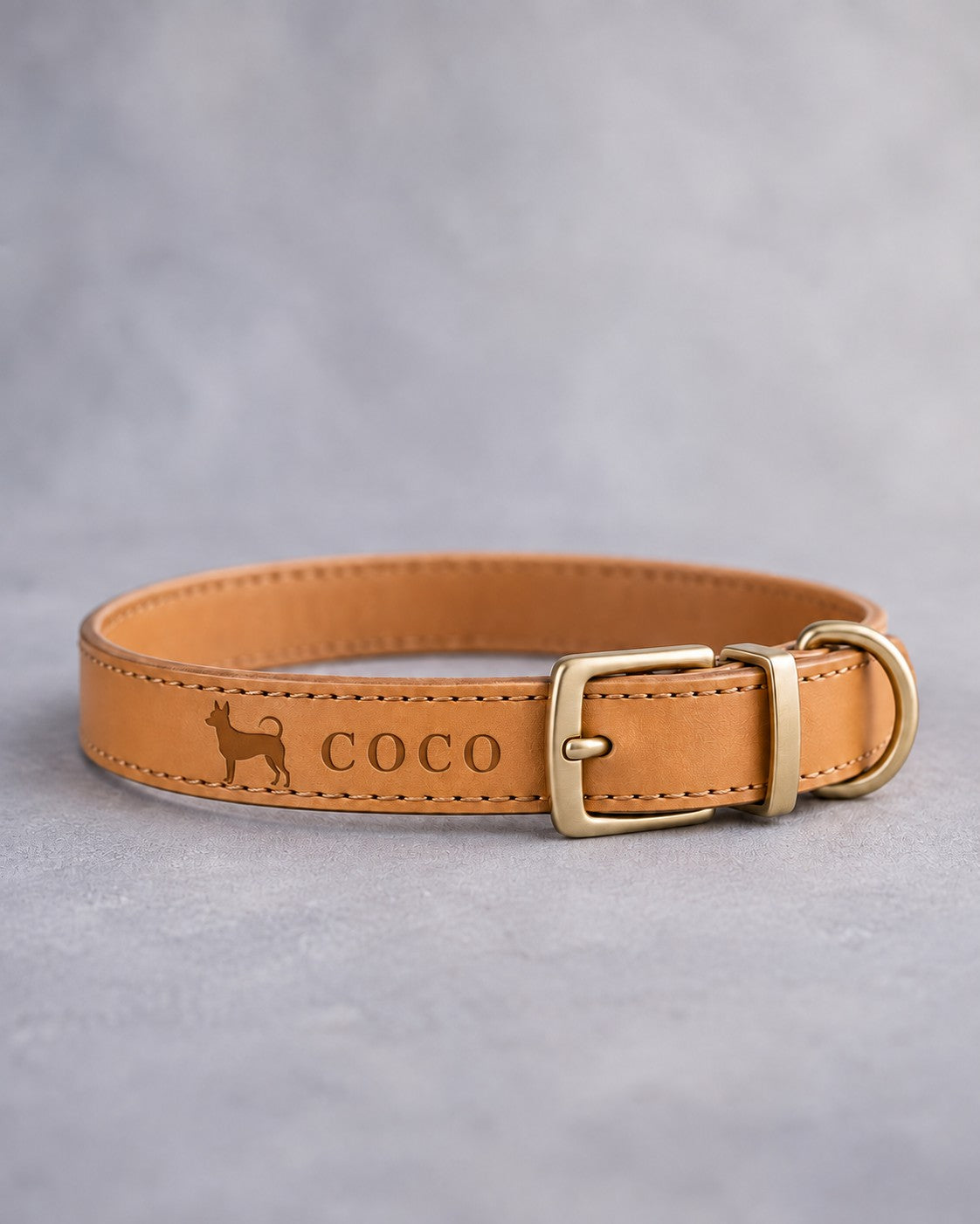 Indian Summer leather dog collar with a chihuahua silhouette and the name COCO debossed, brass pin buckle
