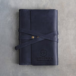 Blueberry leather journal with a logo blind debossed on the cover (sample logo: Leatherius Woodman)