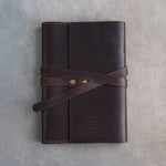 Embossed leather notebook in Dark Espresso with a logo pressed into the cover (sample logo: Leatherius Woodman)