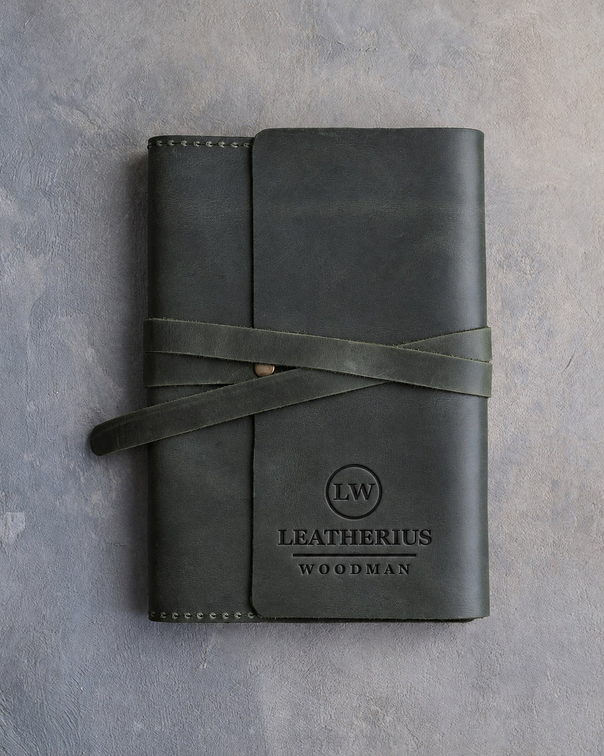Forest Green leather journal with a logo blind debossed on the cover (sample logo: Leatherius Woodman)