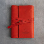 Poppy Red leather journal with a logo blind debossed on the cover (sample logo: Leatherius Woodman)