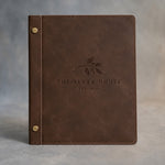 Sicilian Brown leather menu cover debossed with a sample business logo on the front, on a grey plaster backdrop
