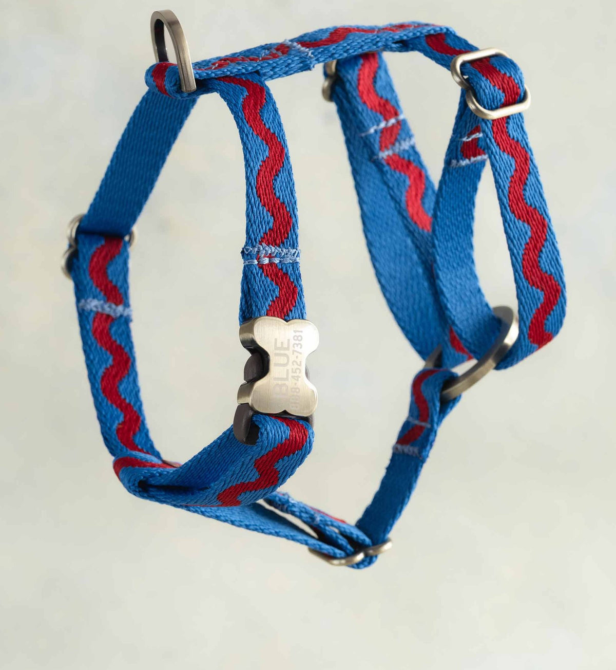 Thin webbing harness for small dogs, Ric-Rac design (a red ric-rac wave on cornflower blue), with an engraved bone buckle