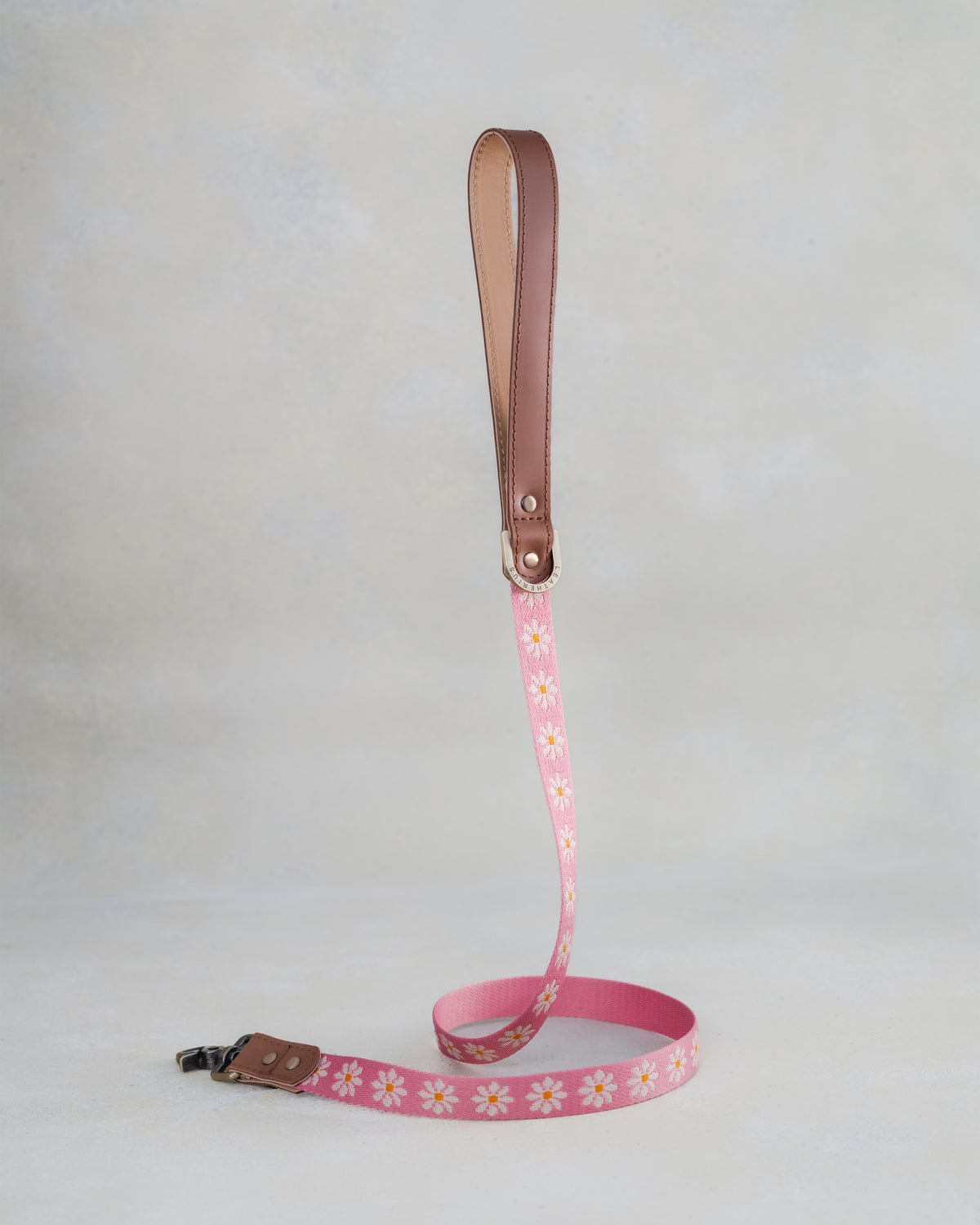 Matching Blush Daisy leash with leather trim and a brass clip