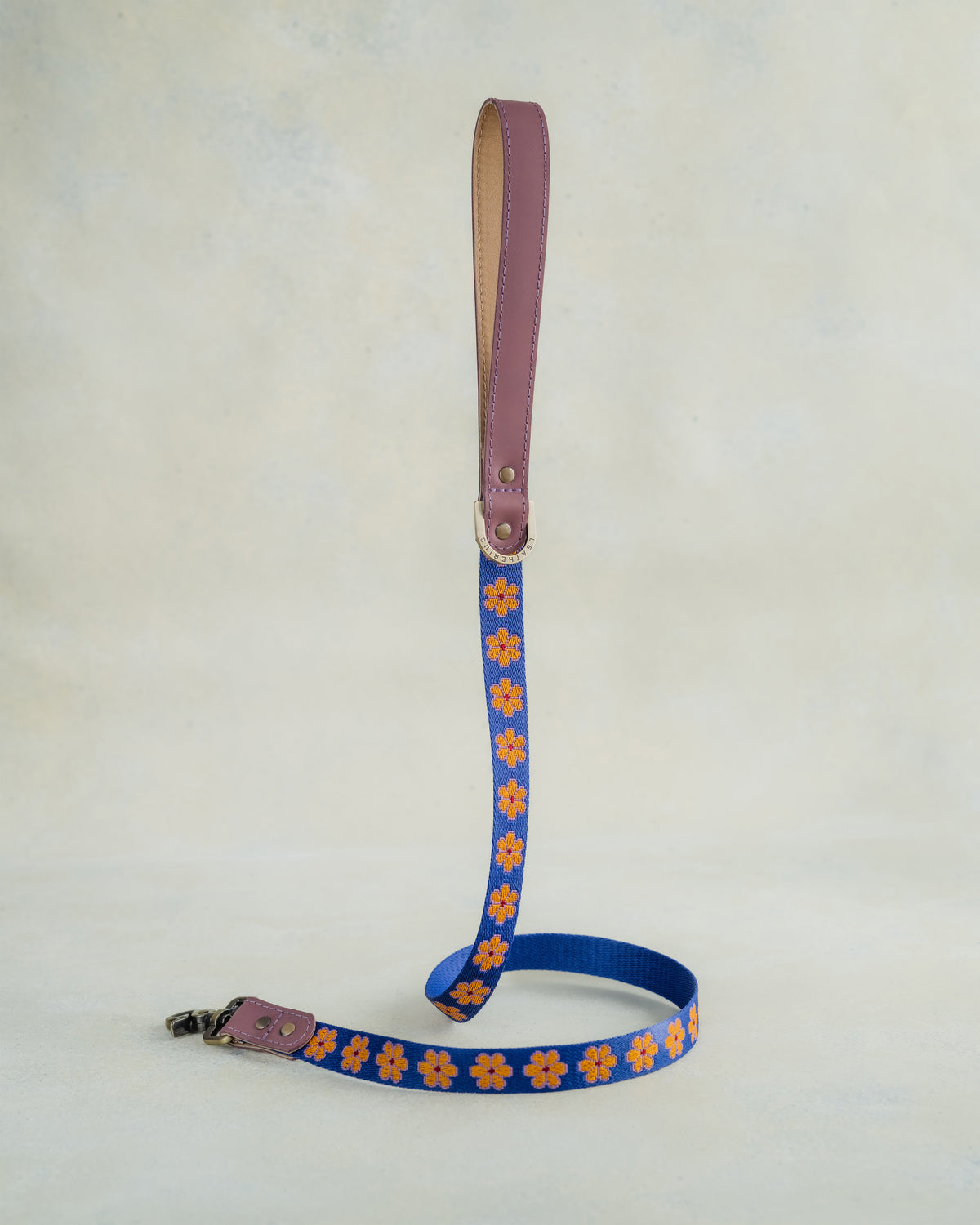 Matching Marigold leash with leather trim and a metal clip