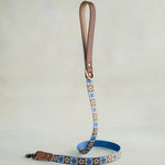 Matching Tan Tiles leash with leather trim and a brass clip
