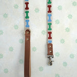 Dog Bones webbing dog leash with a leather handle