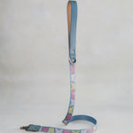 Matching Butterflies leash with leather trim and a brass clip