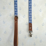 Anchors webbing dog leash with a leather handle