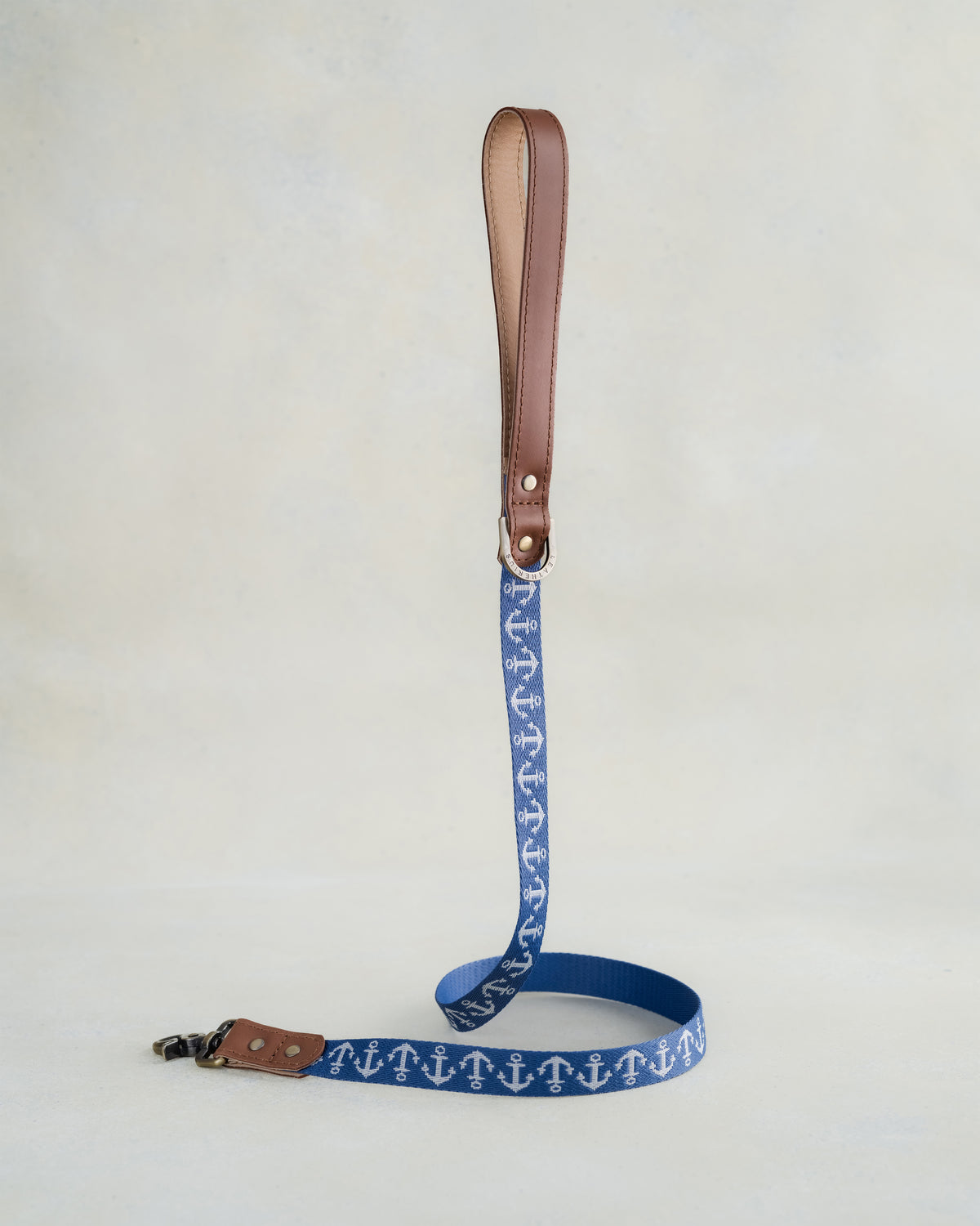 Matching Anchors leash with leather trim and a brass clip