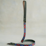 Matching Bow Ties leash with leather trim and a brass clip