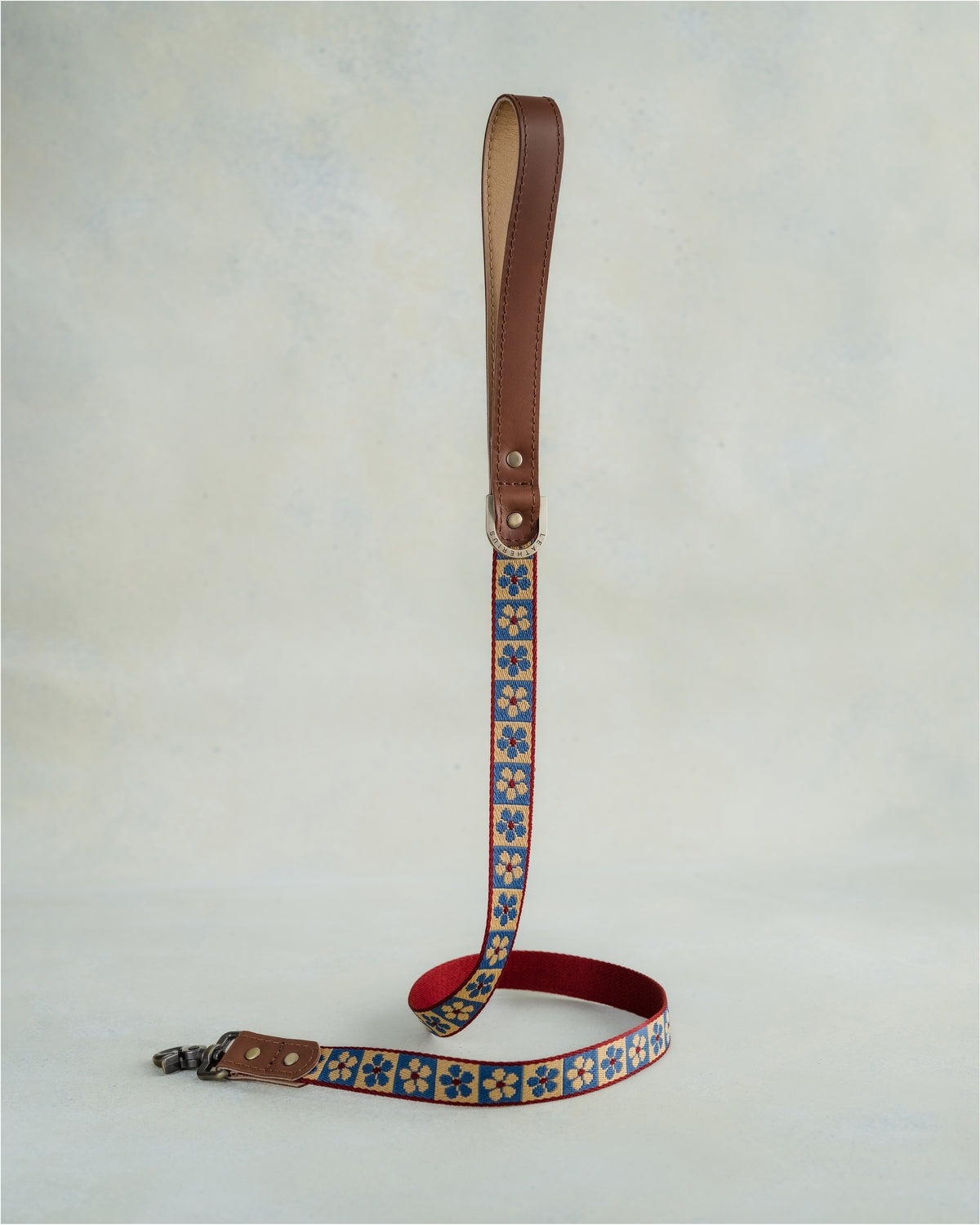 Matching Blue Tiles leash with leather trim and a brass clip