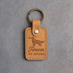 Indian Summer tan leather keychain debossed with a golden retriever and a small star above Forever and MY GOLDEN, on gray concrete