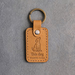 Indian Summer tan leather keychain debossed with a begging dog above This dog and WANTS CAKE, on gray concrete