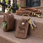 Meatball the Bulldog keychain in reddish brown leather with keys on a cozy living room rug