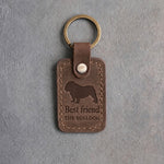 Sicilian brown leather keychain debossed with an English bulldog above Best friend and THE BULLDOG, on gray concrete