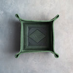 Forest Green leather valet tray with snapped corners and the initials VHC pressed into the diamond frame, seen from above