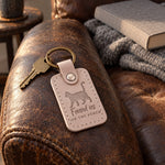Gray Found Us on the Porch keychain on a weathered wooden porch step in morning light