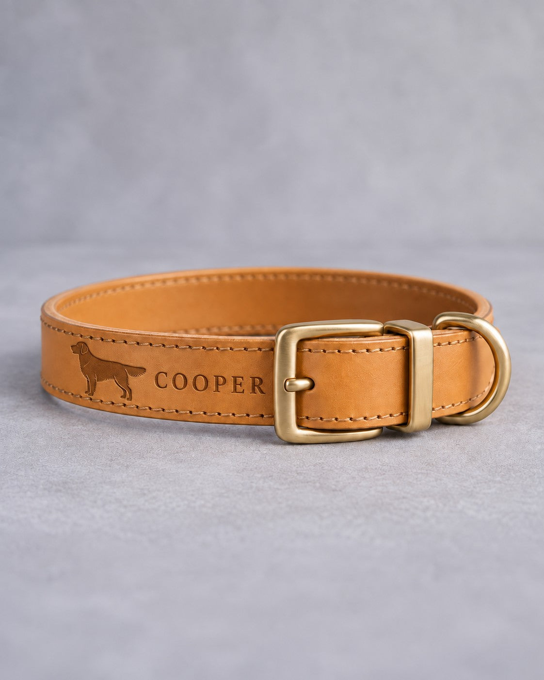 Indian Summer leather dog collar with a golden retriever silhouette and the name COOPER debossed, brass pin buckle