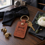 Got him TO THE ALTAR keychain in tan leather on a walnut dresser beside cufflinks before the ceremony