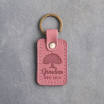 Parisian Blossom pink leather keychain debossed with a solid oak tree above Grandma and EST 2019