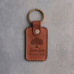 Arizona tan leather keychain debossed with a solid oak tree above Grandpa and AVA·LEO·MAE