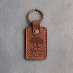 Arizona tan leather keychain debossed with an oak tree and rope swing above Higher and GRANDPA