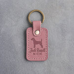 Parisian Blossom pink leather keychain with a debossed Jack Russell and the words Jack Russell MOM on gray concrete