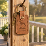 Milo the Jack keychain in caramel leather with keys on a sunny back step