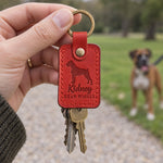 Poppy red Kidney Bean Wiggle leather keychain placed in a warm everyday setting