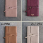 Leather journals in Blush, Sangria, Caramel and Gray Sand on grey plaster