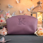 Lilac leather makeup bag with an engraved initial